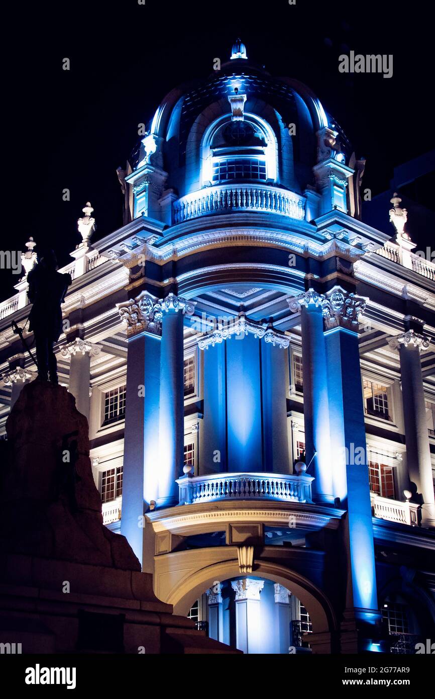 Night scene of the Townhall of Guayaquil city in Ecuador. A blue lighting representing the colors of the city flag. Stock Photo