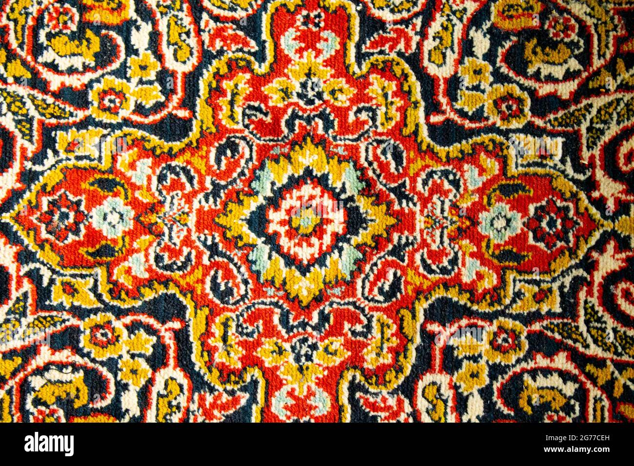 Wall carpet. Red carpet with an abstract pattern. Stock Photo
