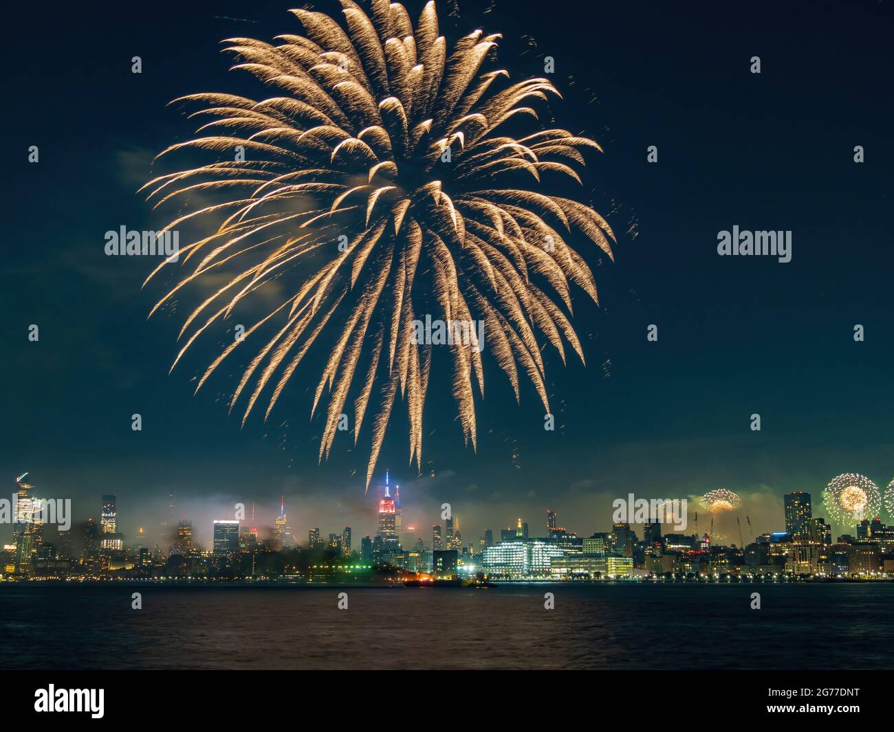 Fireworks celebration of July 4th with the famous Manhattan skyline at