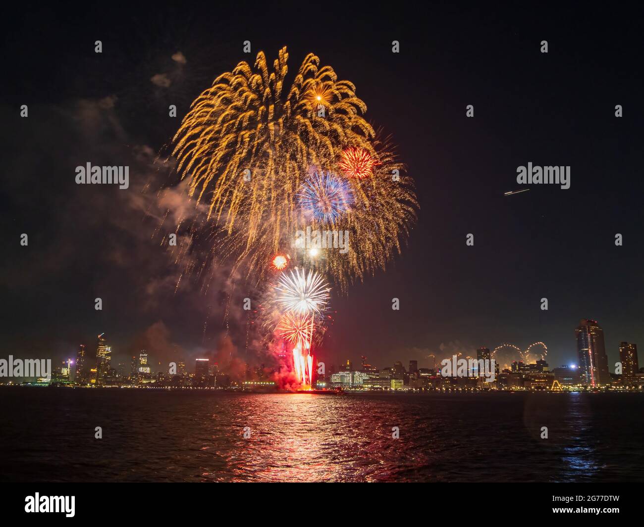 Fireworks celebration of July 4th with the famous Manhattan skyline at