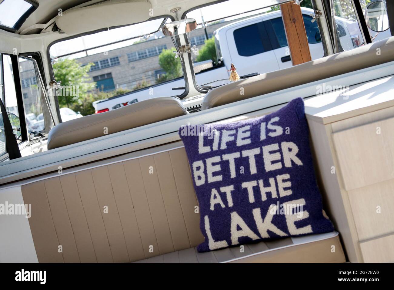 Life Is Better At The Lake pillow inside VW Bus Stock Photo