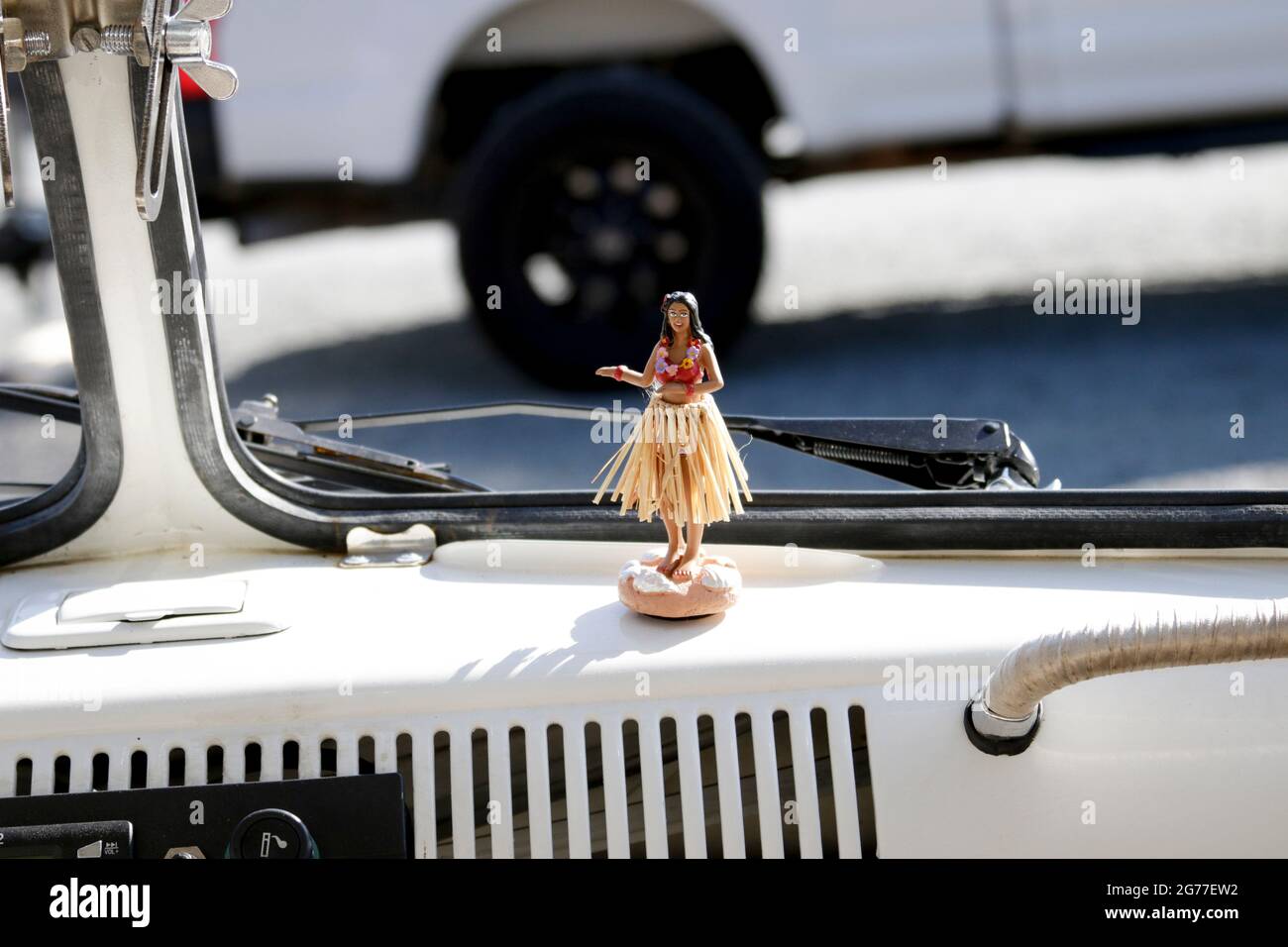 Hula Dancer Doll on VW Bus Dashboard Stock Photo