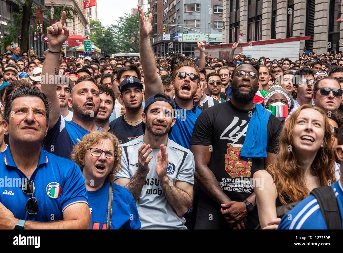 A few hundred Italy fans cheer on their Azzurri in the Euro Cup 2020 final  against England outside Ribalta Italian restaurant on E12th Street in New  York City on July 11, 2021.
