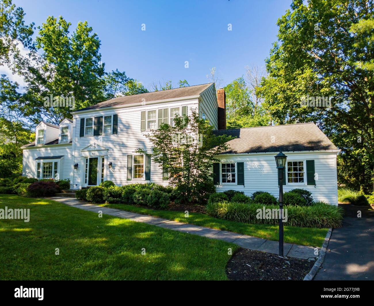 New York, JUL 4, 2021 Sunny view of a beautiful woooden house Stock