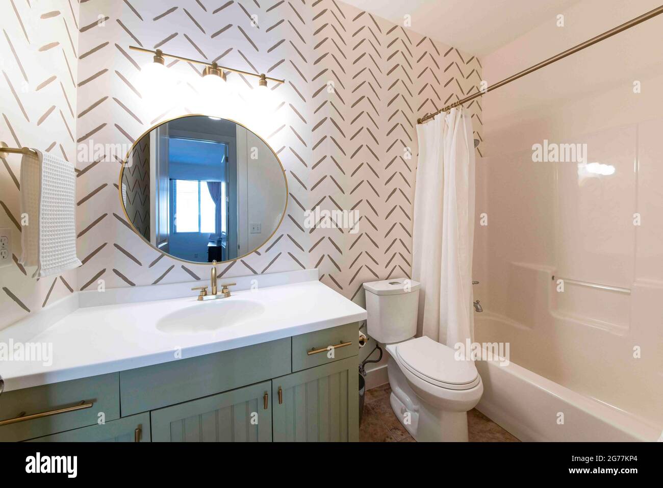Small bathroom interior with minimalist wallpaper design Stock Photo ...