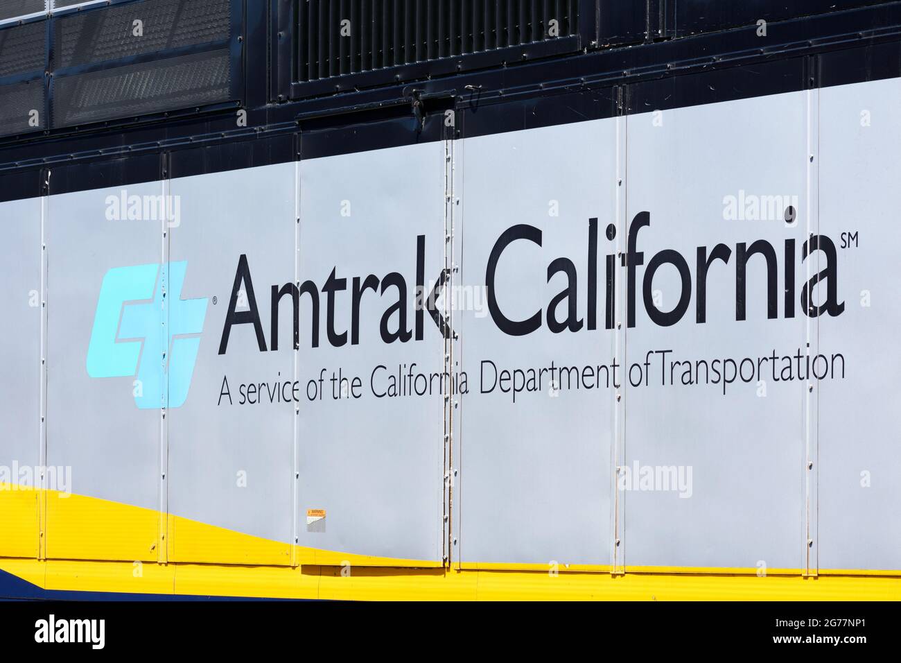Amtrak California a service of the California Department of Transportation sign on diesel passenger locomotive. - San Jose, California, USA - 2021 Stock Photo