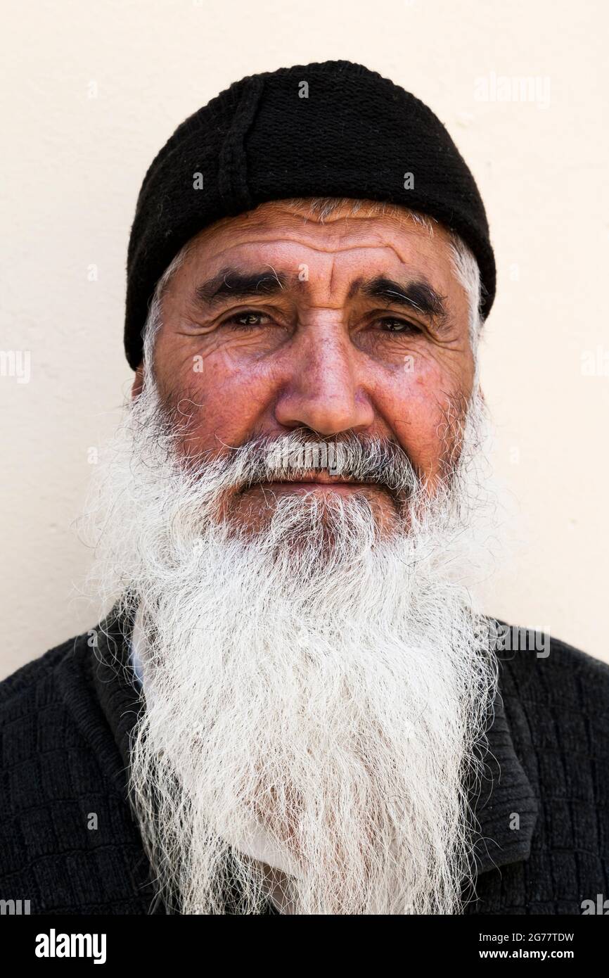 Man with long white beard, at backyard of Tehran bazaar, historical trading center, Tehran, Iran, Persia, Western Asia, Asia Stock Photo