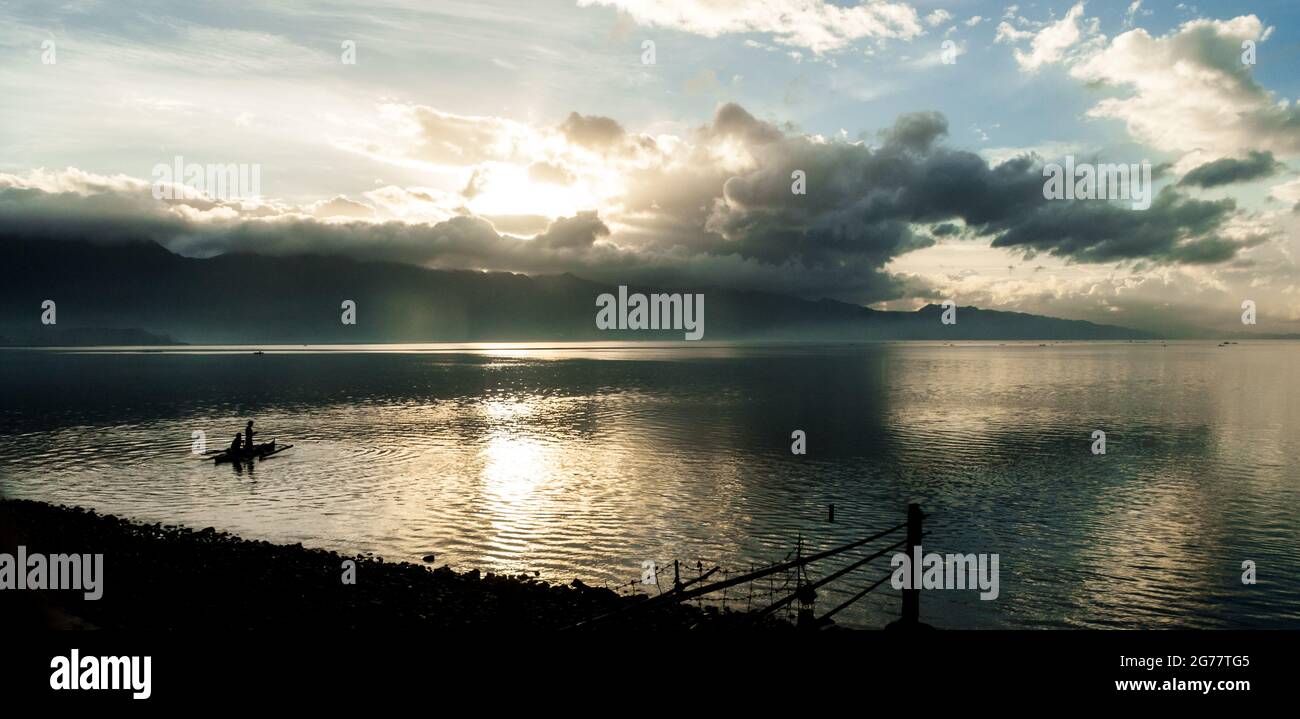 Silhouette small fishing boat hi-res stock photography and images - Alamy
