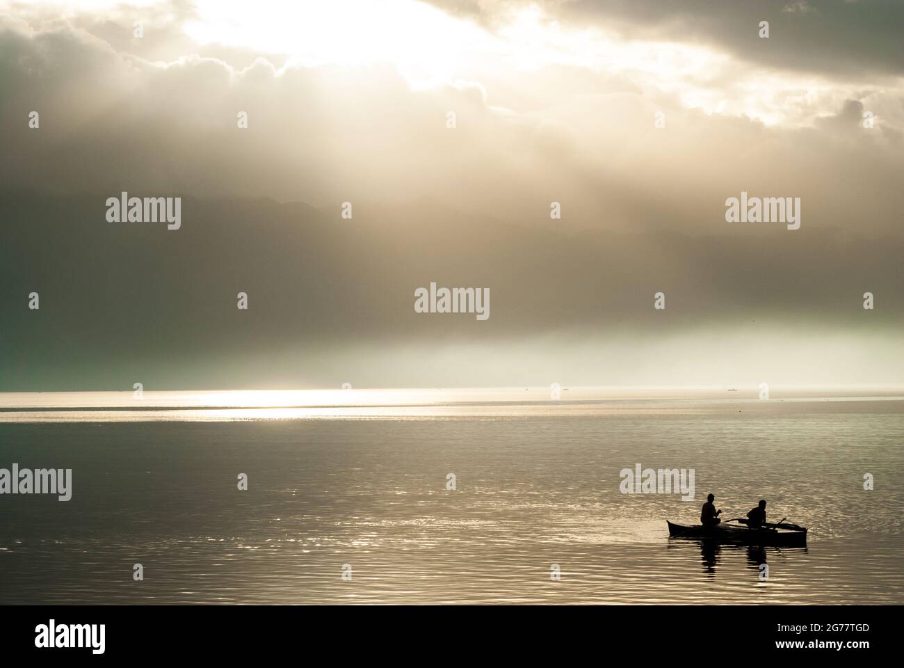 silhouette of fishermen on a boat Stock Photo - Alamy
