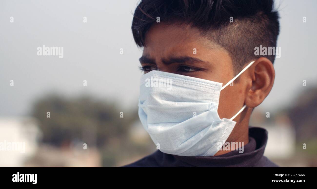 Closeup shot of an Indian boy wearing a mask- new normal concept Stock  Photo - Alamy