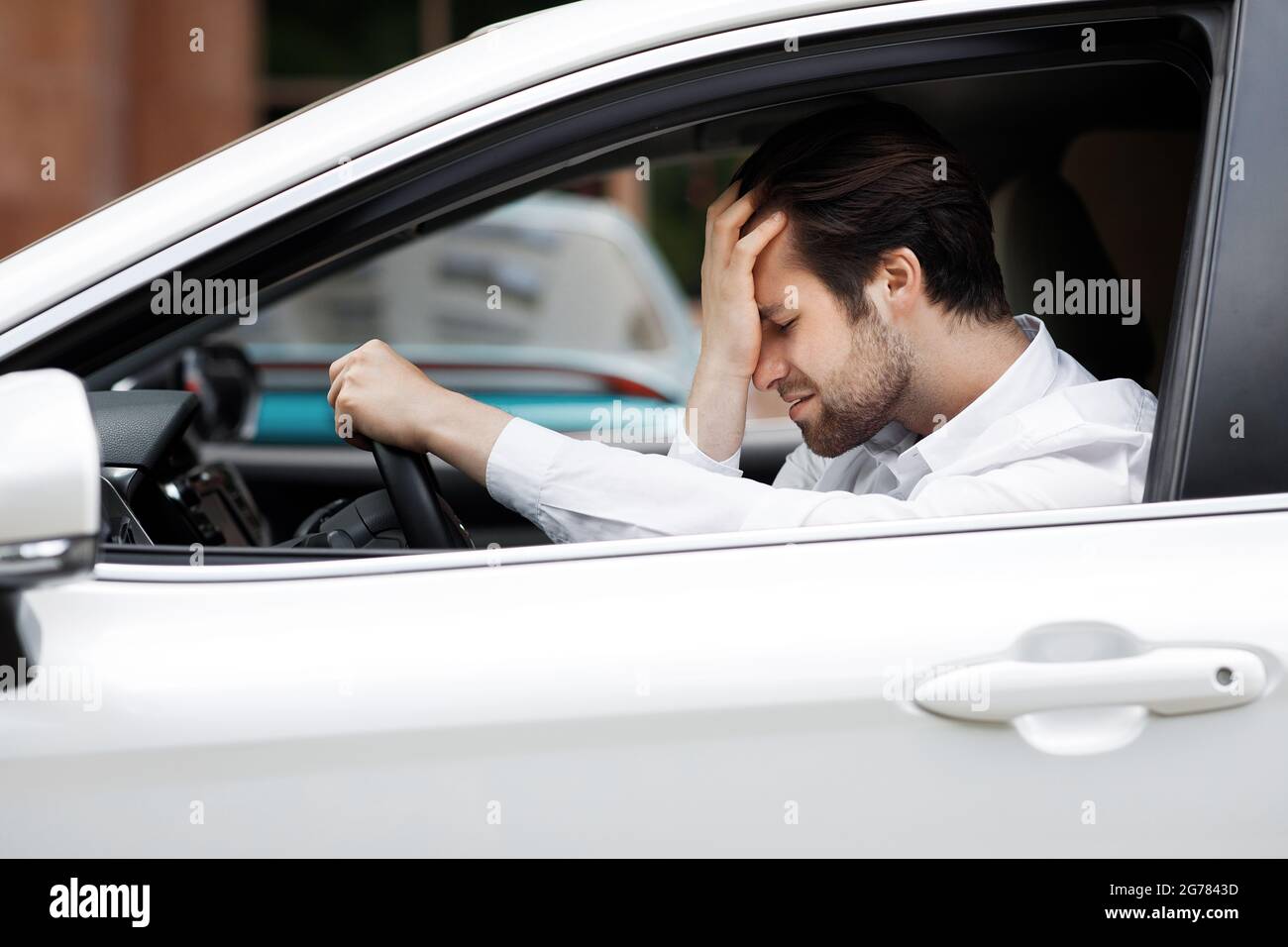 Upset driver, stressful situations on road and fast rhythm in modern city Stock Photo
