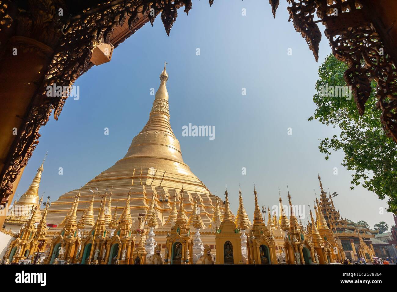 Yangon, Myanmar - Jauary 2020: Shwedagon Pagoda, Yangon, Myanmar. View from a decoratively carved archway to  the central pagoda Stock Photo