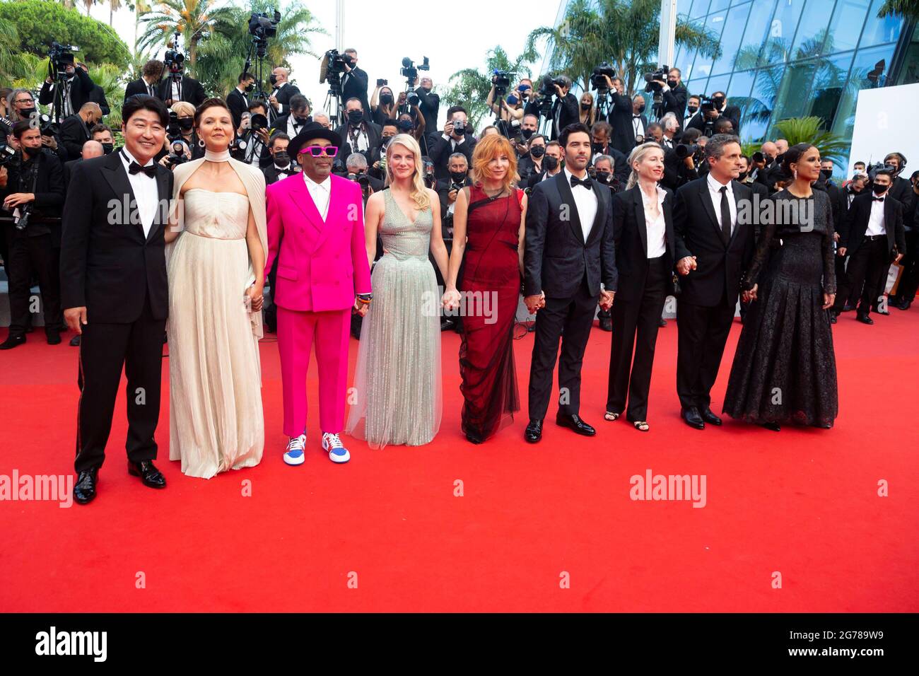 Song Kang-Ho (l-r), Tahar Rahim, Mylène Farmer, Maggie Gyllenhaal, Jury president Spike Lee, Mélanie Laurent, Jessica Hausner, Kleber Mendonça Filho and Mati Diop attend the premiere of 'Annette' during the 74th annual Cannes Film Festival in Cannes, France, on 06 July 2021. Stock Photo