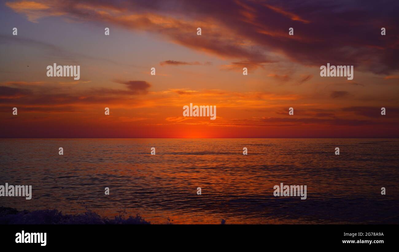 blue orange sunset on the sea Stock Photo - Alamy