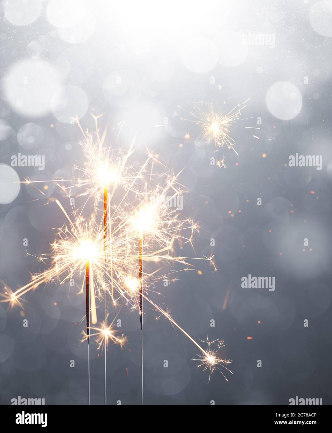 Glittering sparklers, Merry Christmas and Happy New Year Stock Photo