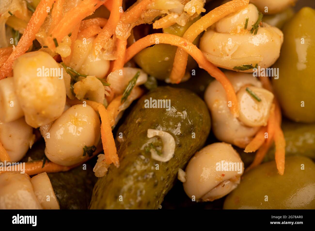 Pickled mushrooms and pickled cucumbers. Close-up Selective focus Stock Photo