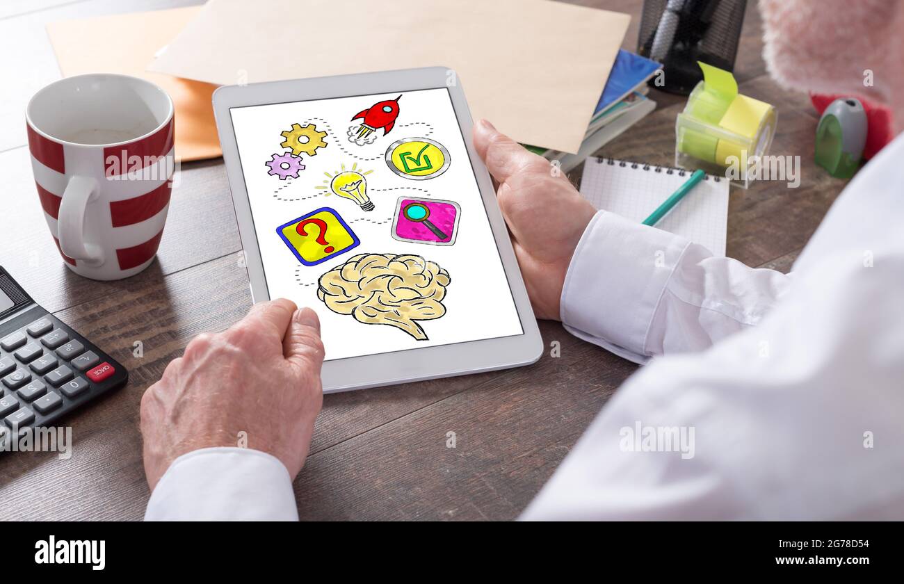 Problem solving concept shown on a tablet held by a man Stock Photo