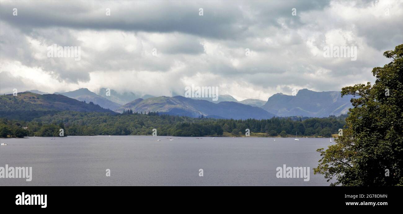 Storm Clouds Threaten. View over Windermere to cloud cover over the  Cumbrian Mountains. Stock Photo