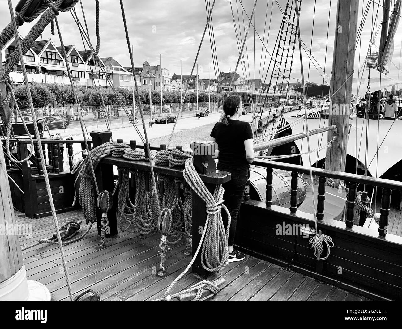 a woman stands on the upper deck of the historic merchant ship Lisa von Lübeck Stock Photo