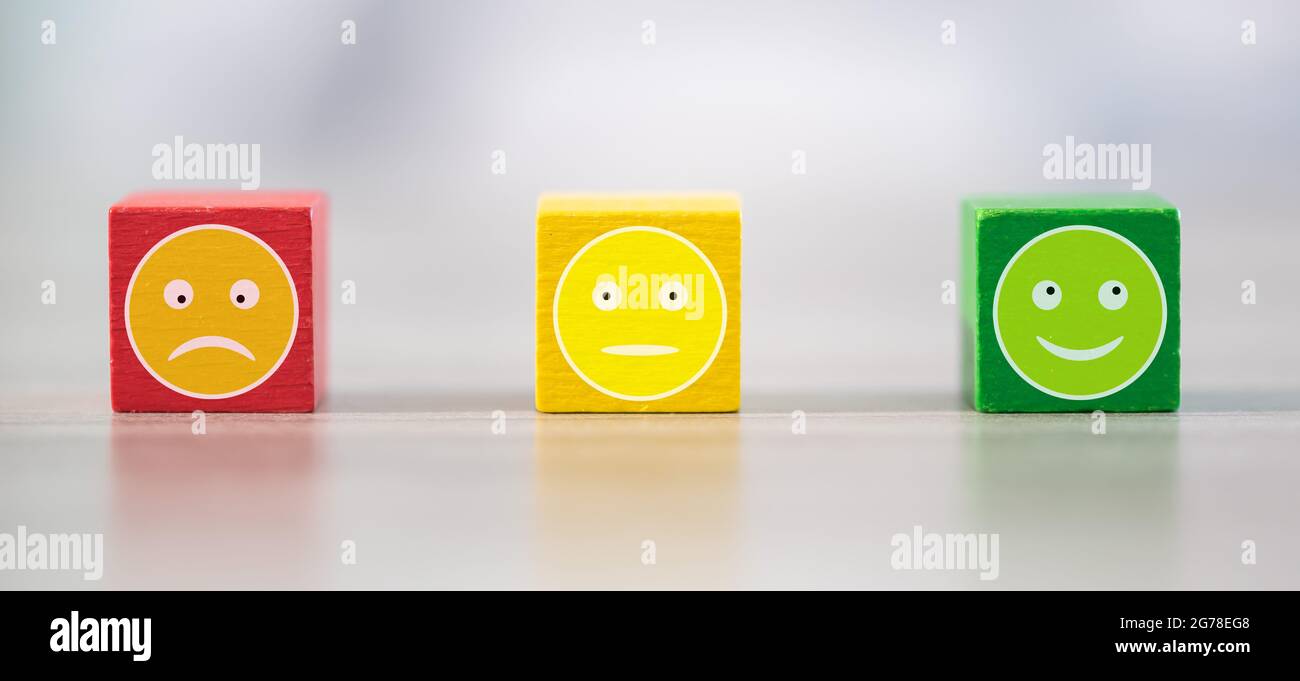 Customer service evaluation concept with wooden cubes Stock Photo - Alamy