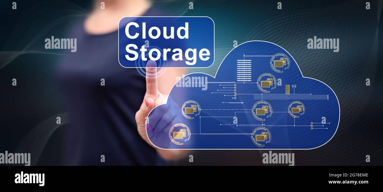 Woman touching a cloud storage concept on a touch screen with her ...
