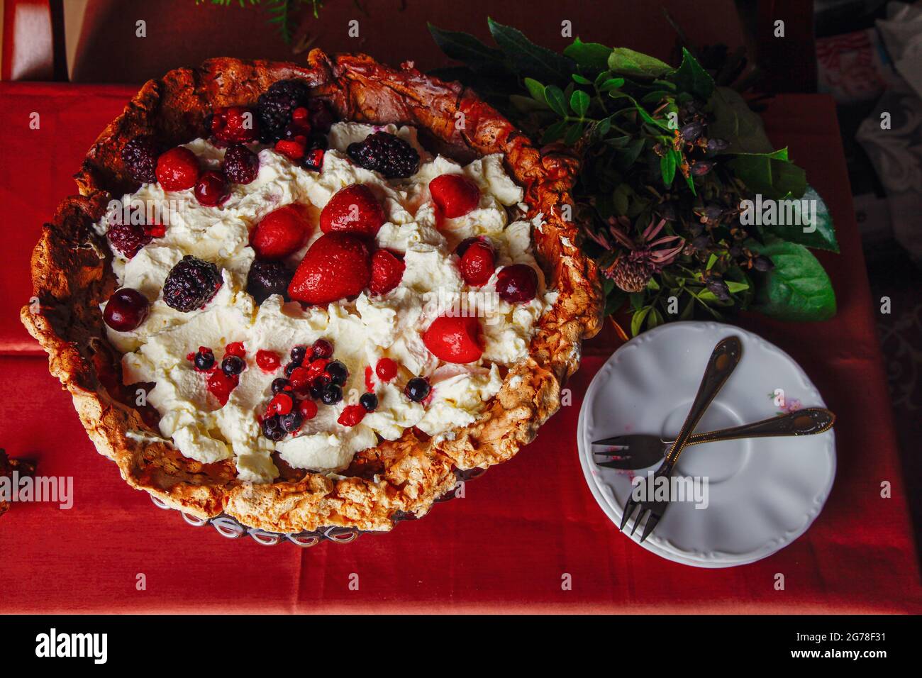 Pavlova, dessert, meringue, mascarpone, strawberries, forest fruits Stock Photo