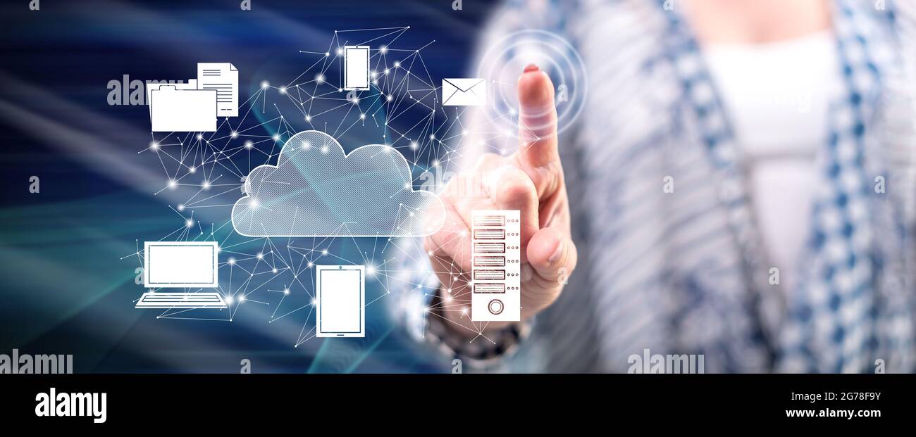 Touch In Computing Woman touching a cloud computing concept on a touch screen with her ...