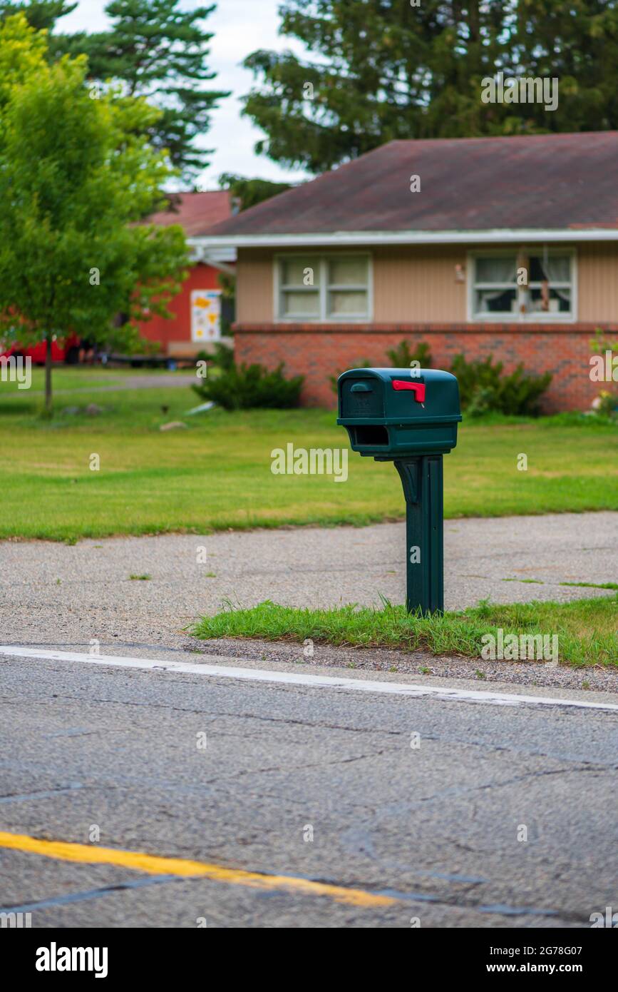 New green mailbox in a rural residential setting Stock Photo Alamy