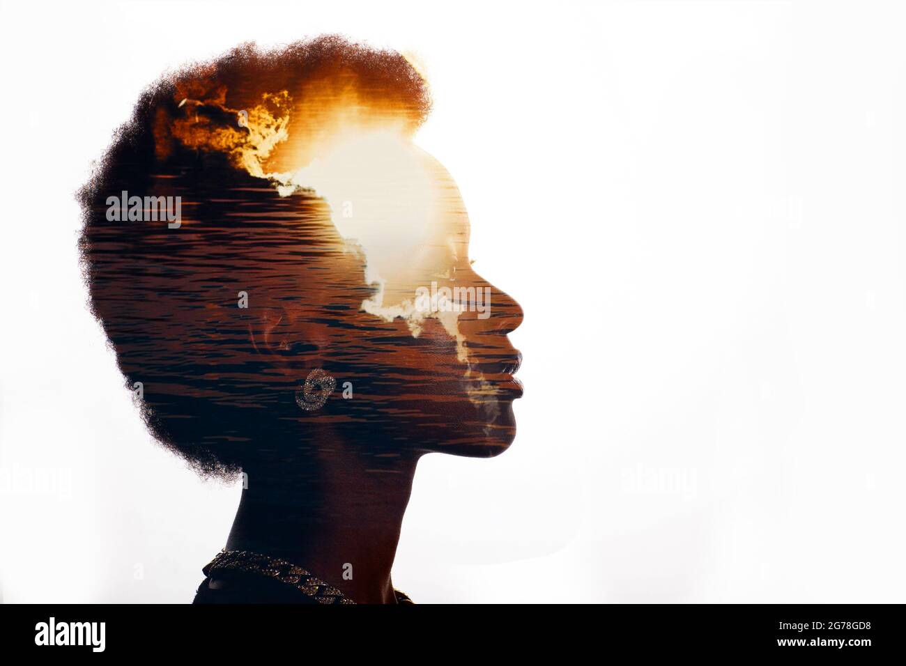 Multiple exposure image with sunrise and sea inside african american woman silhouette. Black Lives Matter mental state and freedom mindset concept. Stock Photo