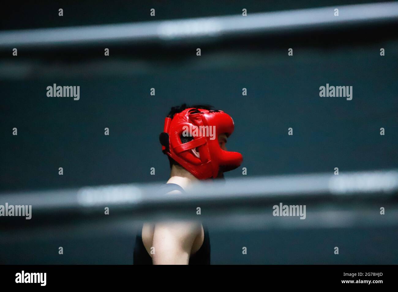 boy with red boxing helmet in the ring Stock Photo