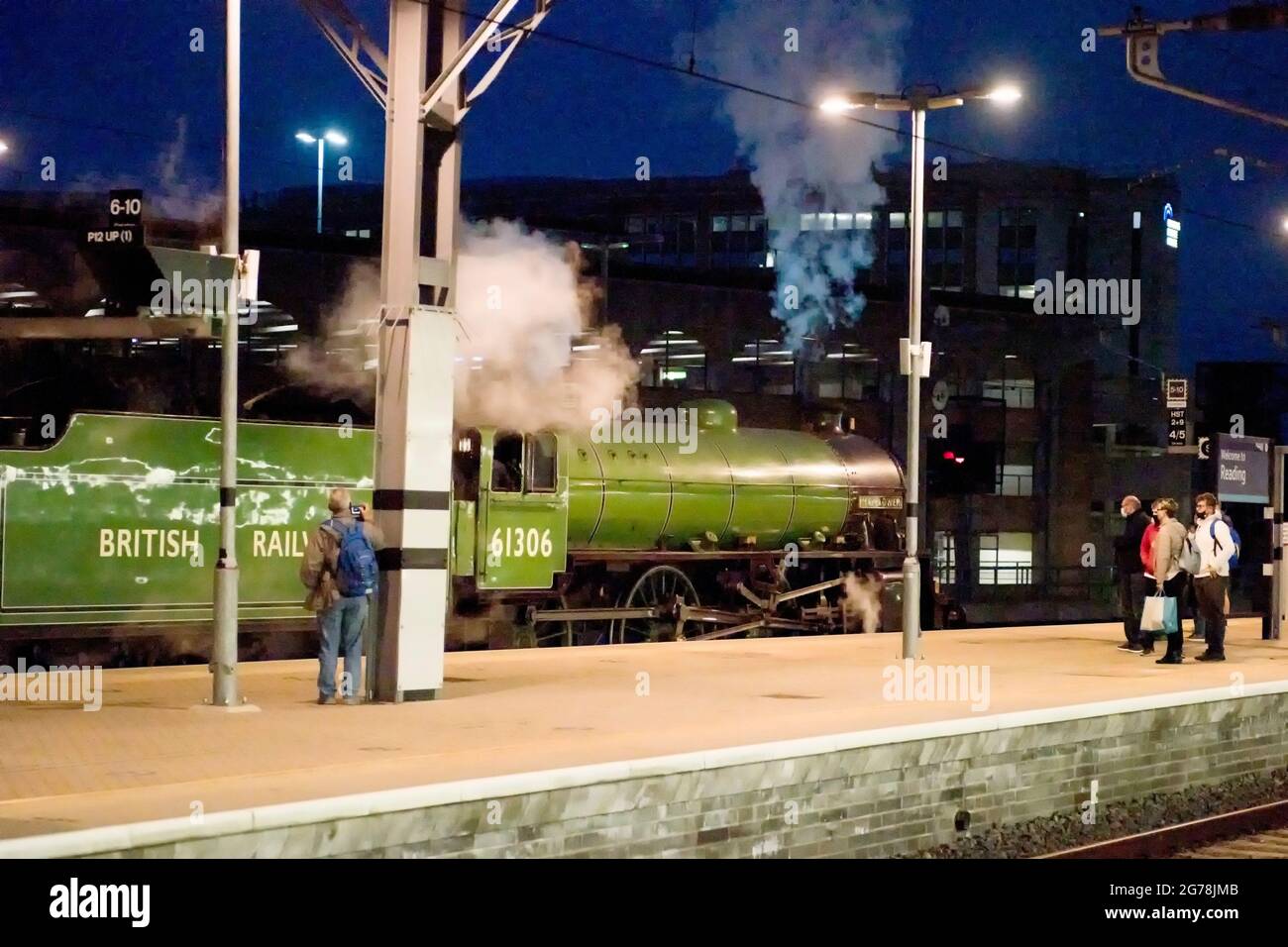 Steam locomotive B1 class 61306 pauses at Reading Station with a return special charter train on it's way back to London Paddington Stock Photo