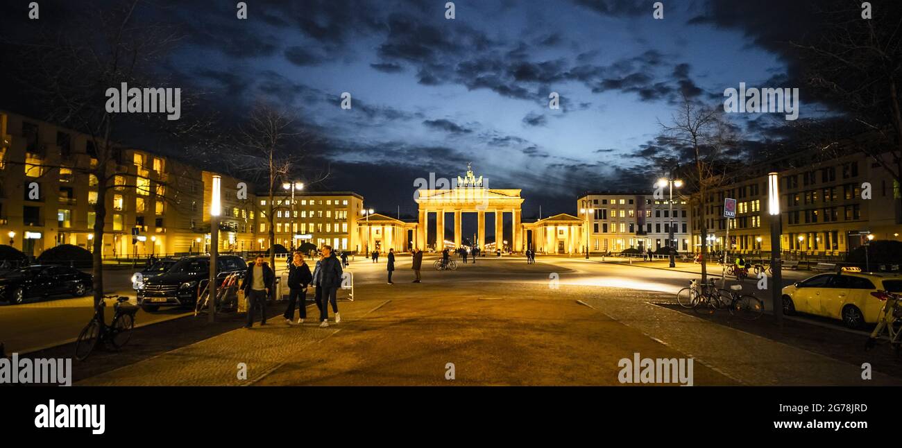 Famous street in Berlin - Unter den Linden with Brandenburg Gate - travel photography Stock Photo