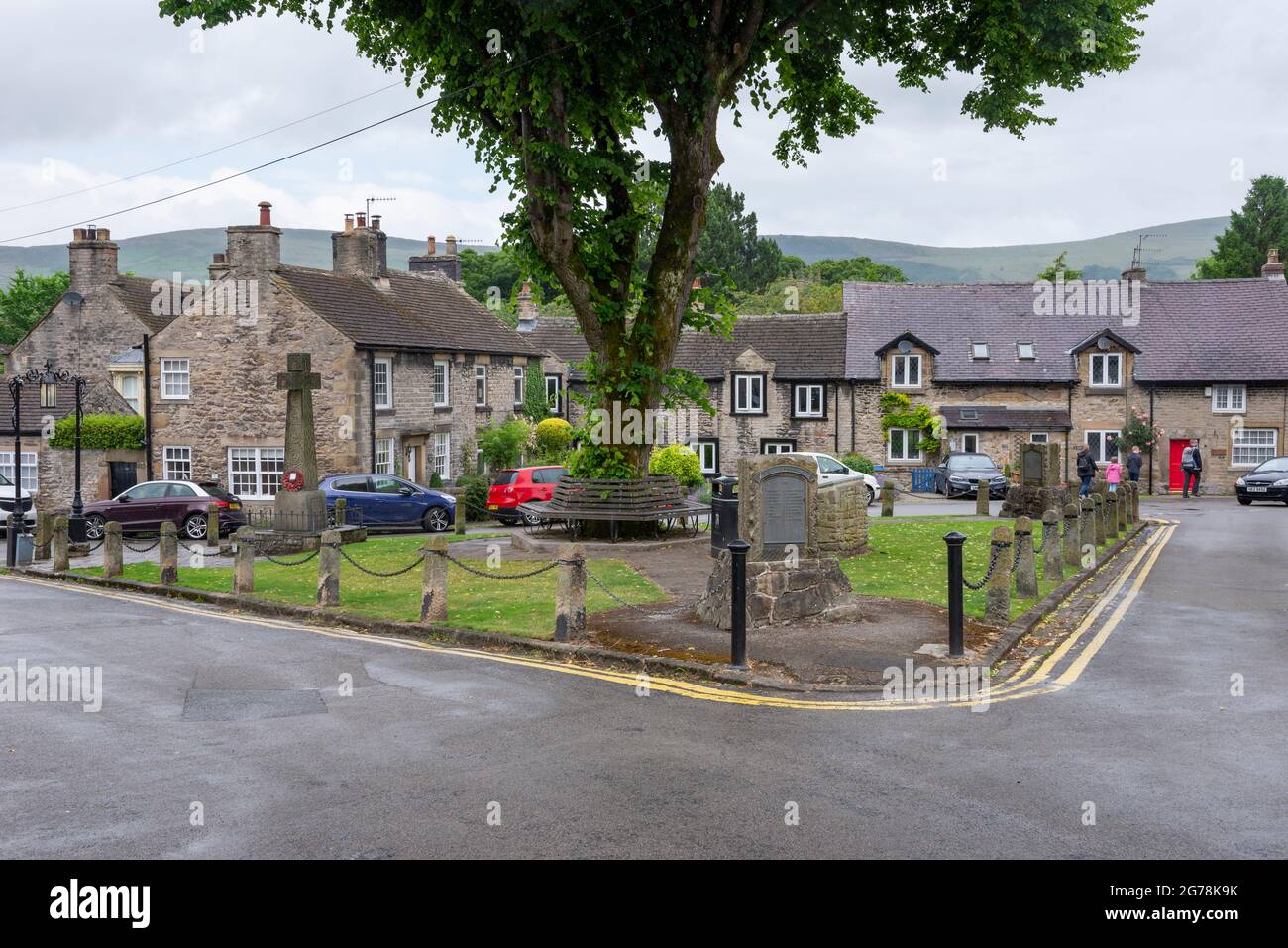 Old stone cottages around the village green in Castleton, Peak District