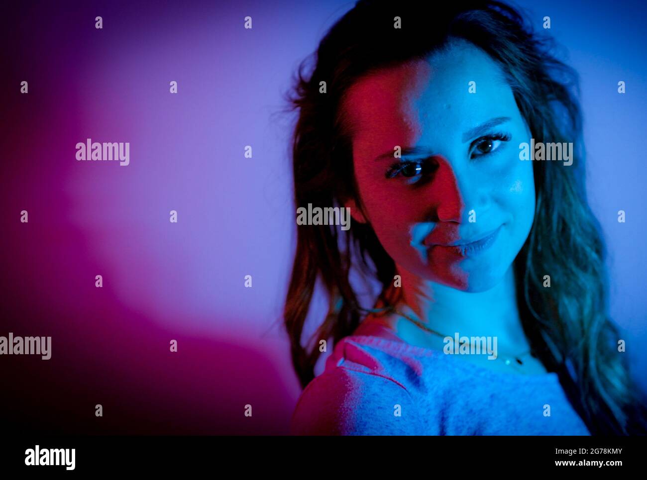 Young woman in her mid-20s - RGB colored portait shot Stock Photo