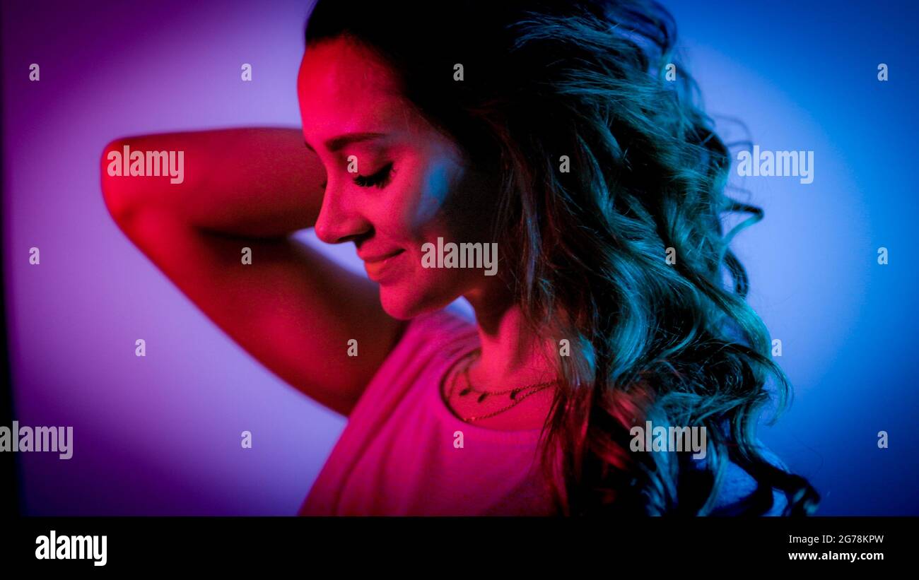 Young woman in her mid-20s - RGB colored portrait shot Stock Photo