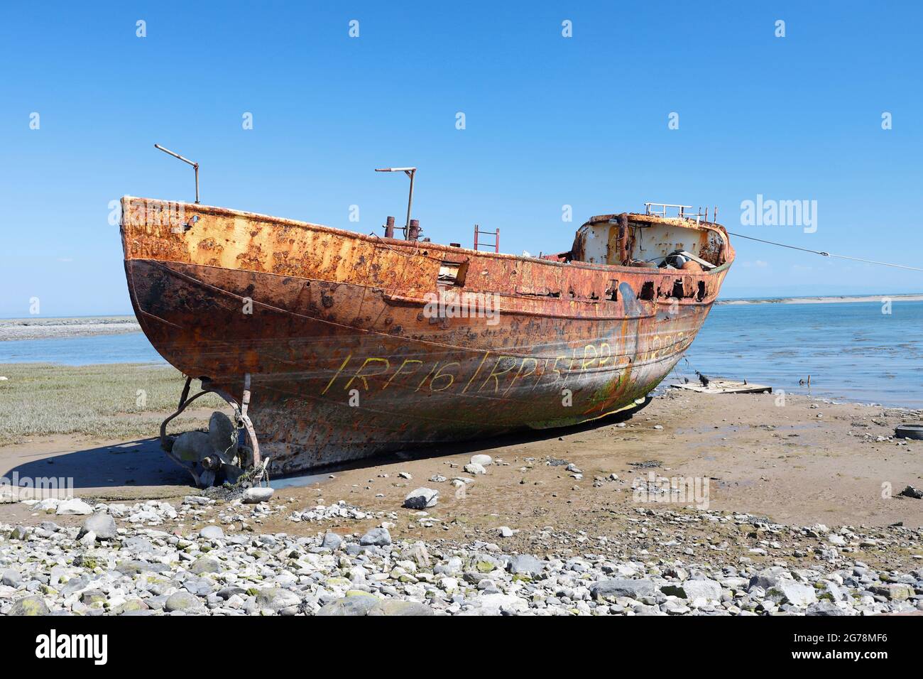 Rusting Boat in Morecambe Bay, Cumbria Stock Photo