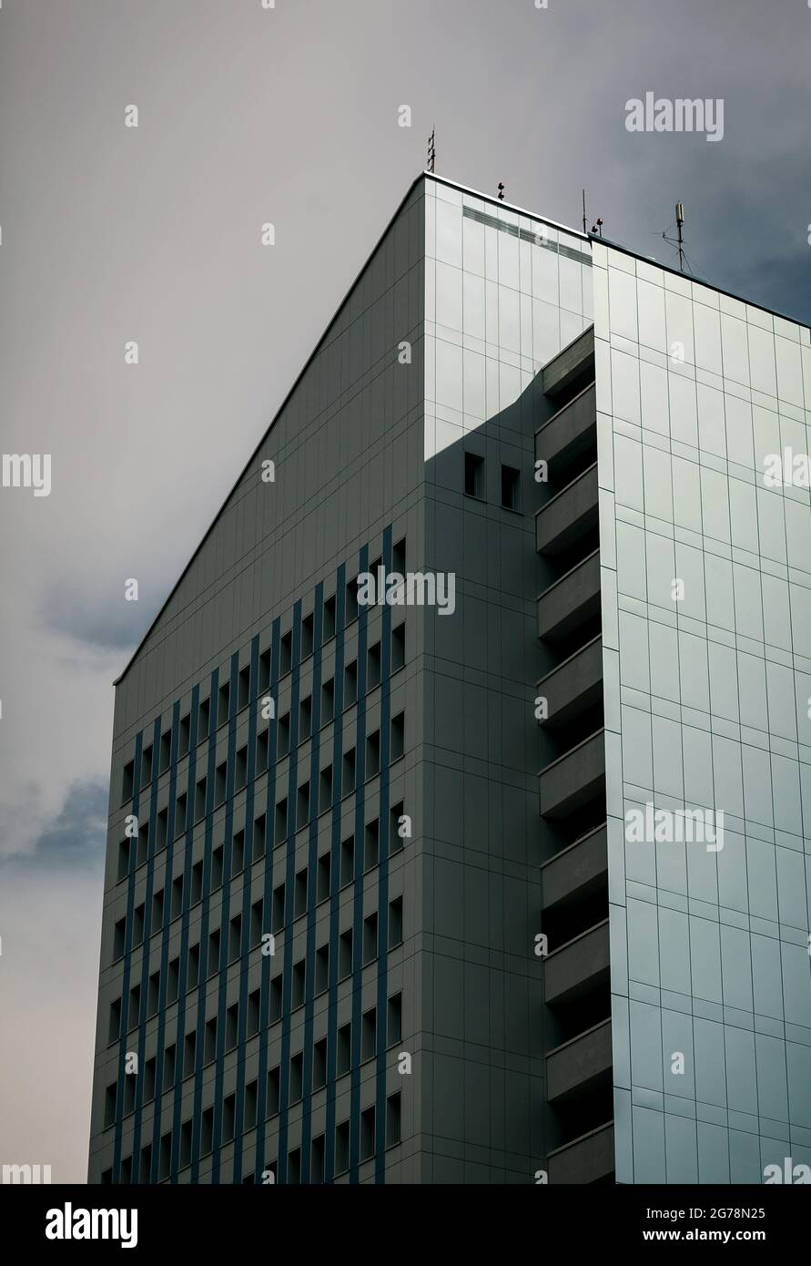 modern office building against sky background Stock Photo - Alamy