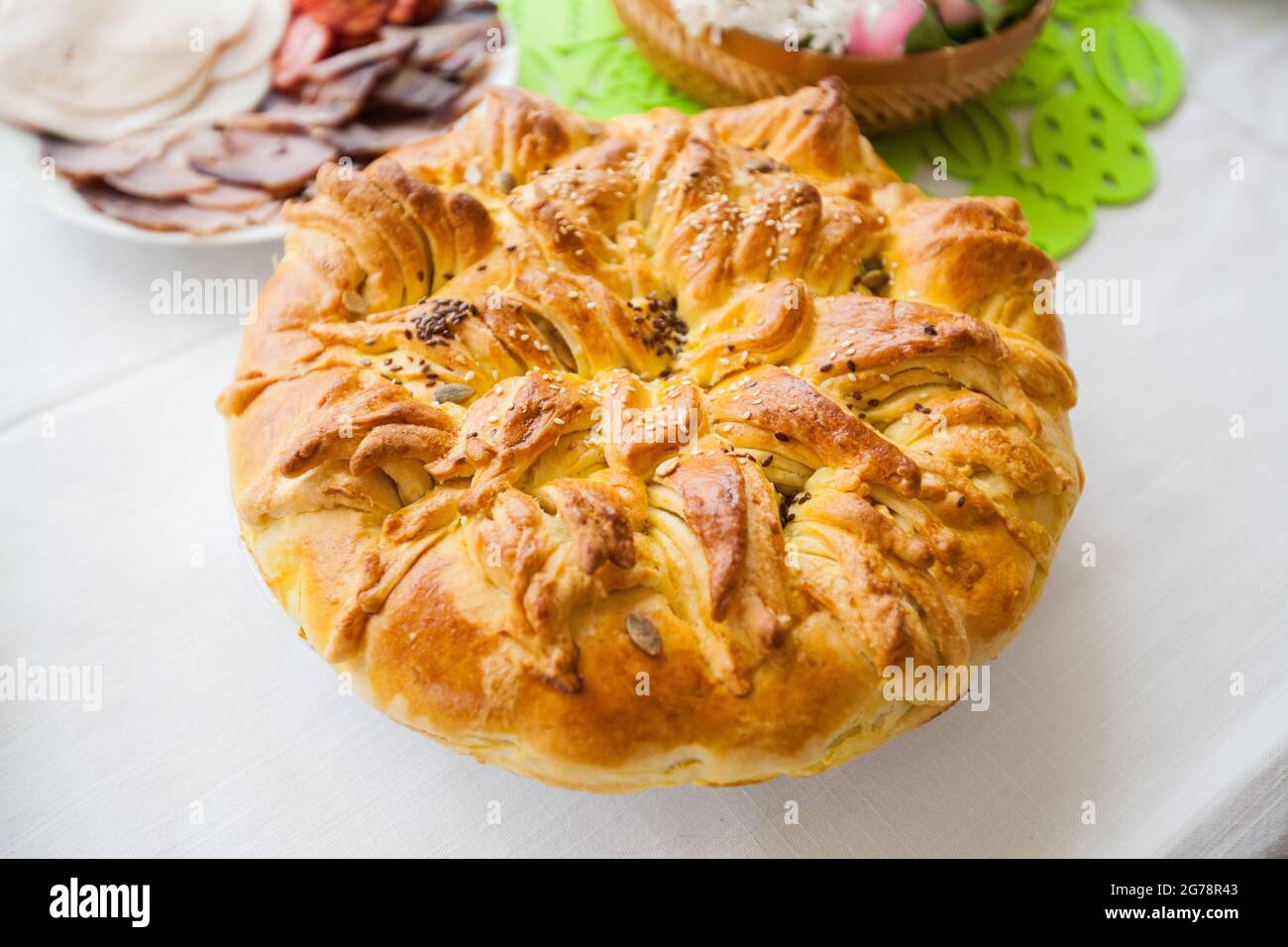Traditional handmade holiday bread, food serving on table,  Eastern orthodox Easter day at home. Stock Photo