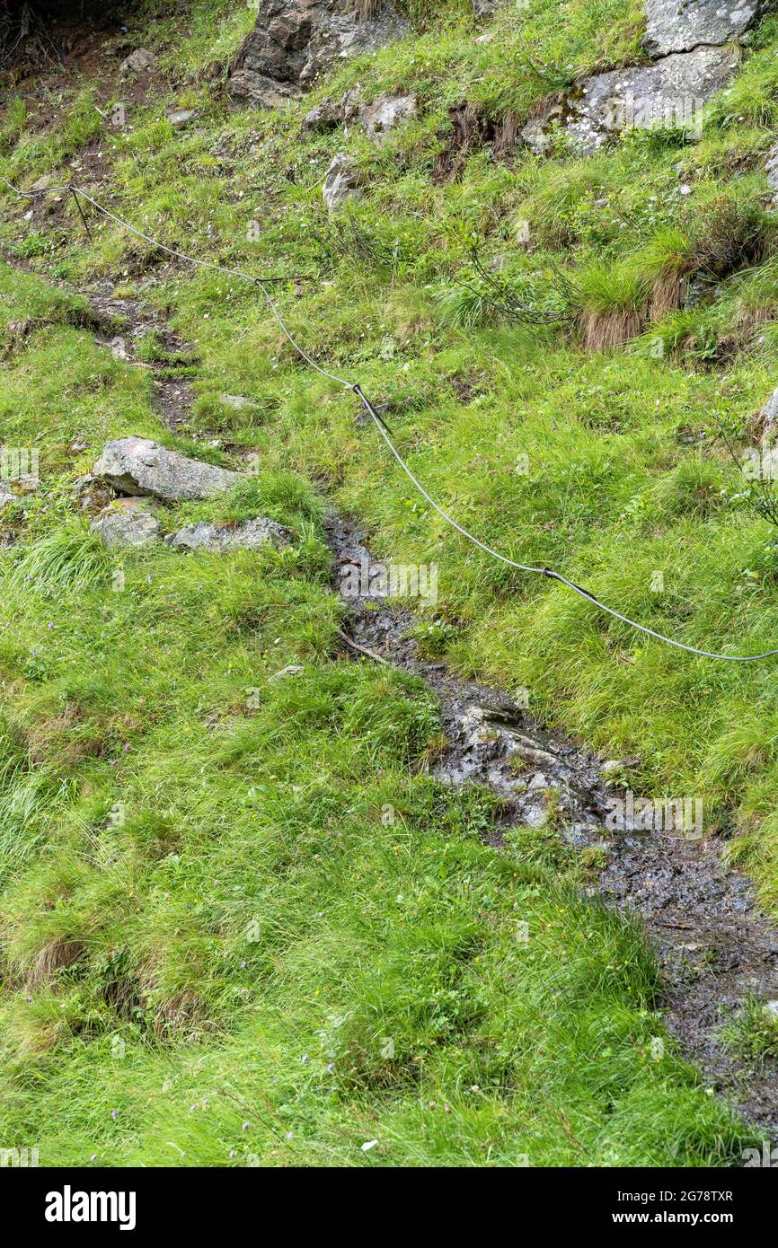 Europe, Austria, Tyrol, Ötztal Alps, Ötztal, Längenfeld, narrow hiking trail with rope insurance through a steep slope Stock Photo