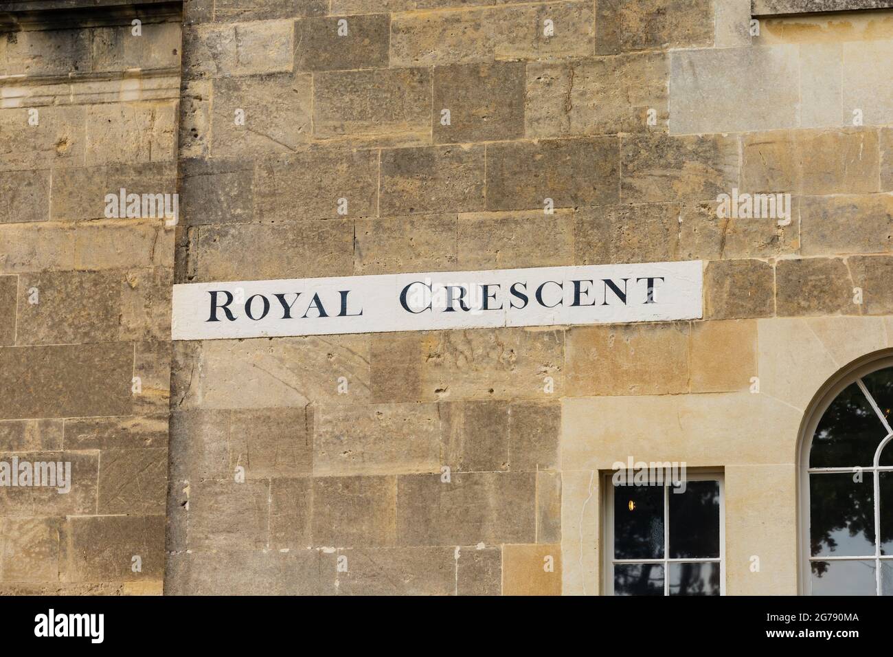 Hand painted 'Royal Crescent' street name sign od wall with windows. The Roman City of Bath, Somerset, England Stock Photo