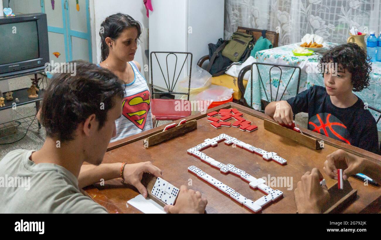 Cuban youth playing dominoes at a home, 2017 Stock Photo