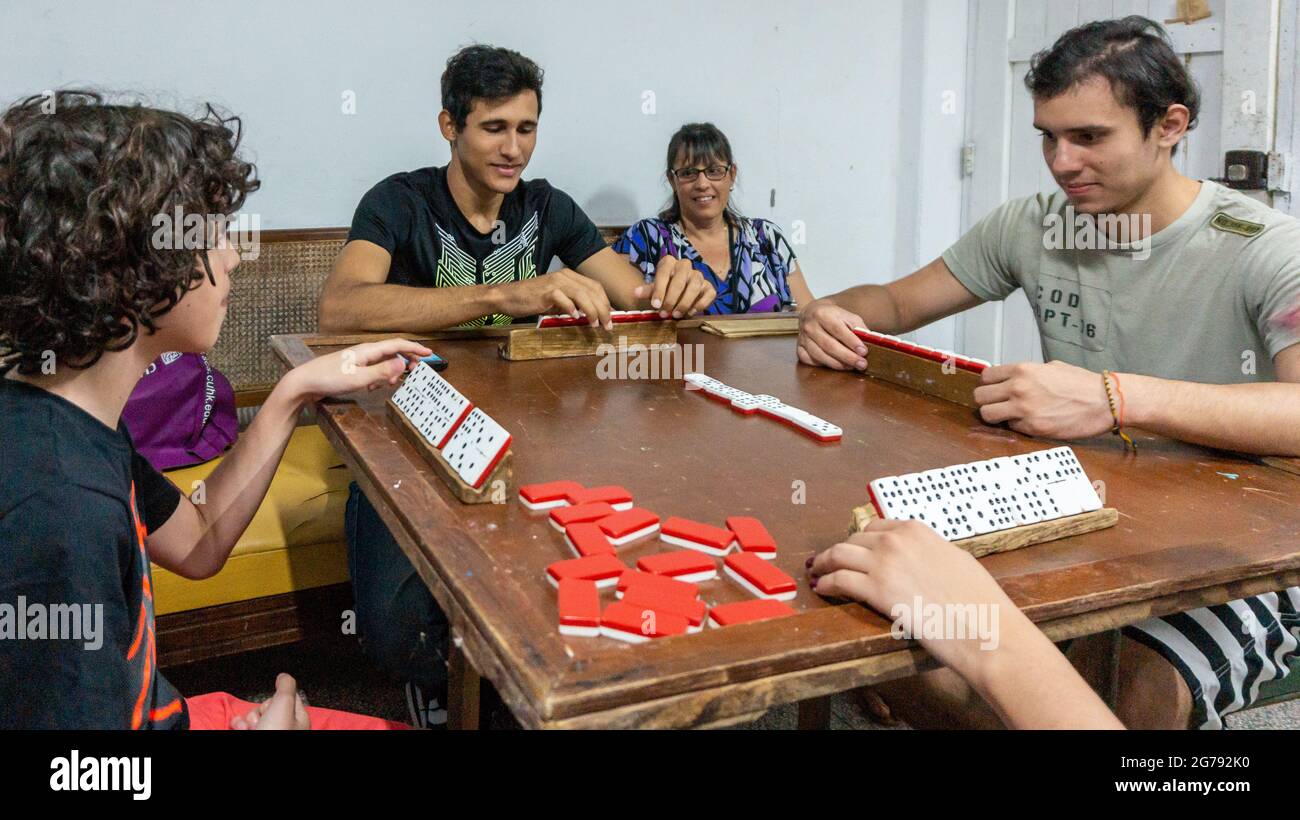 Cuban youth playing dominoes at a home, 2017 Stock Photo