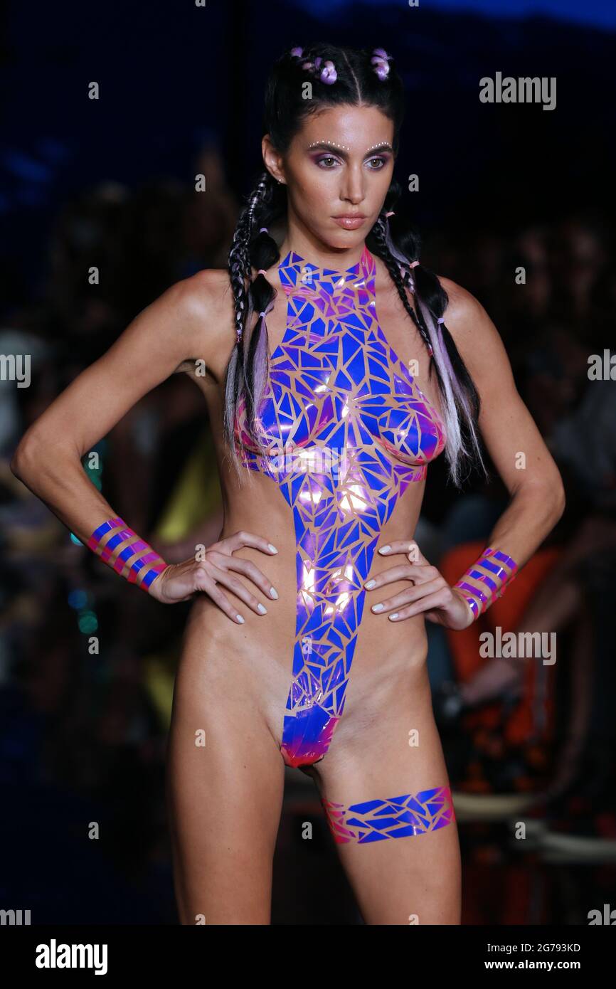 MIAMI BEACH, FLORIDA - JULY 11: A model walks the runway at the BLACK TAPE PROJECT Show during Miami Swim Week Powered By Art Hearts Fashion at Faena Forum on July 11, 2021 in Miami Beach, Florida  People:  Model .  Credit: hoo-me.com/MediaPunch Stock Photo