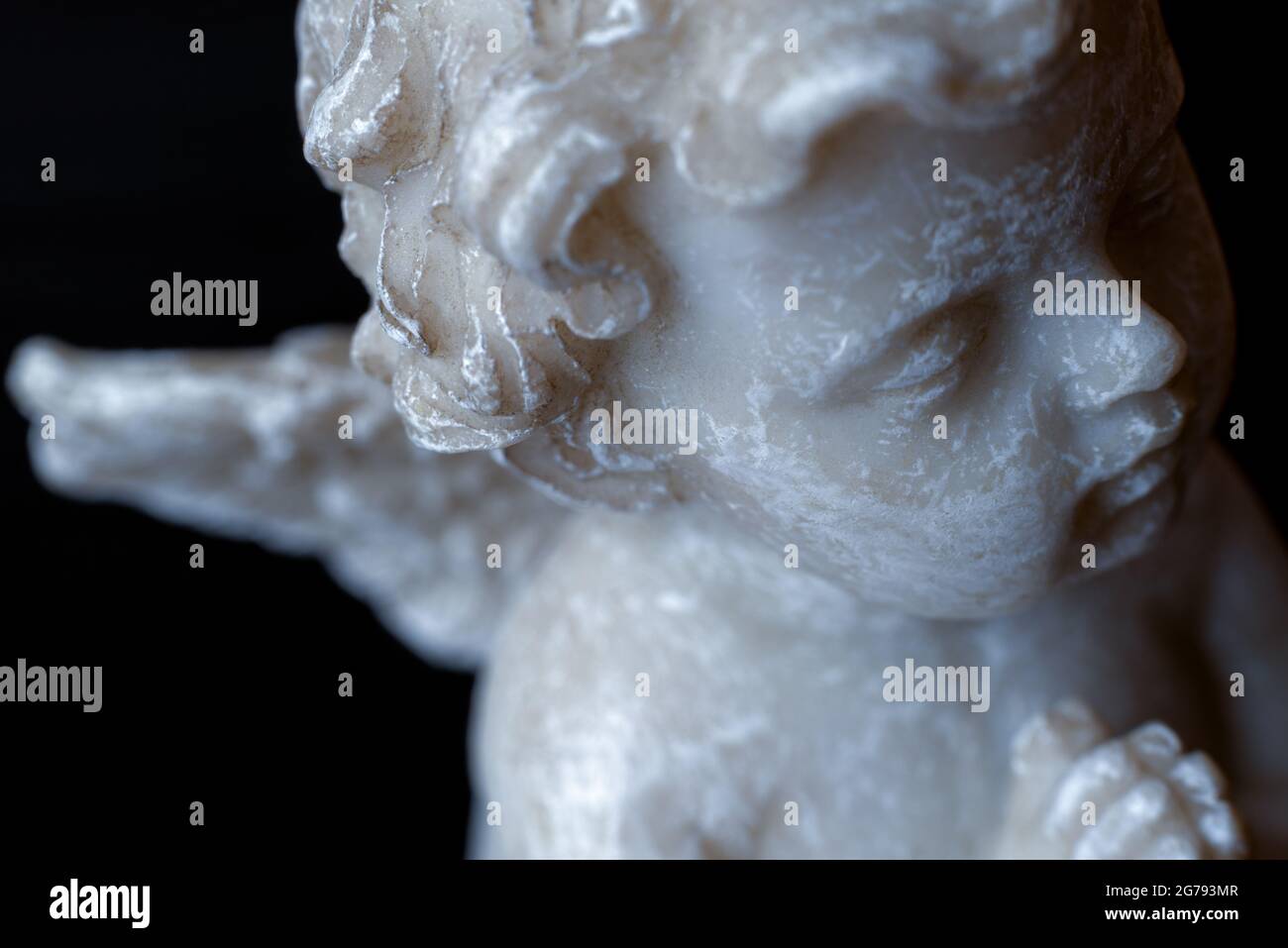 A part of white angel statue on black background Stock Photo