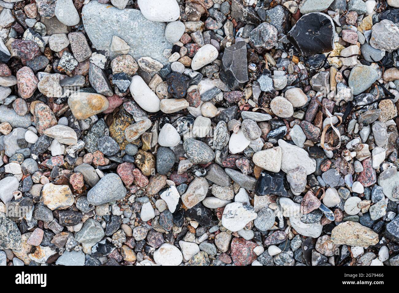 top view of pebbles or stones on beach, full-frame nature background Stock Photo