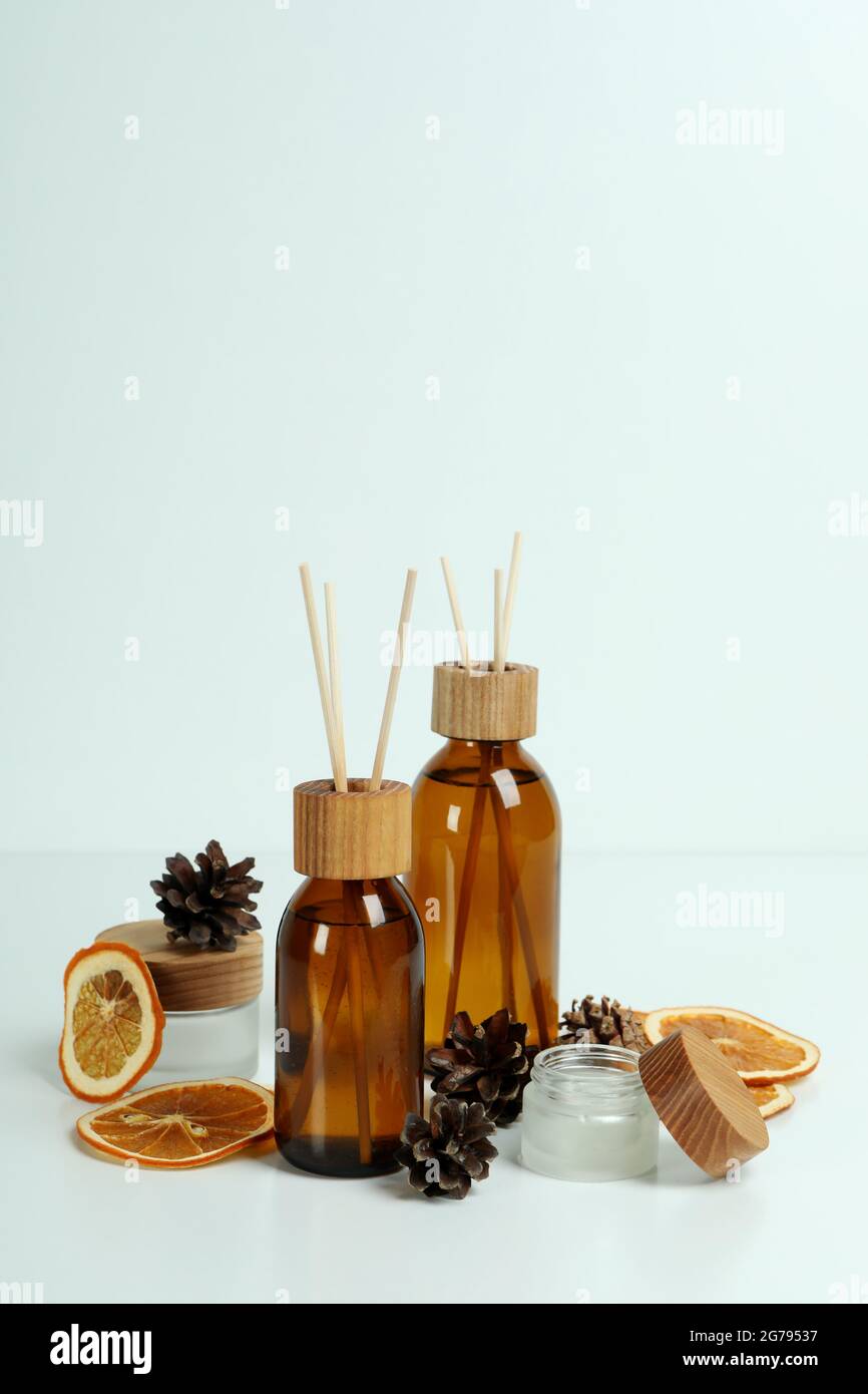 Diffusers, lemons and cones on white background Stock Photo