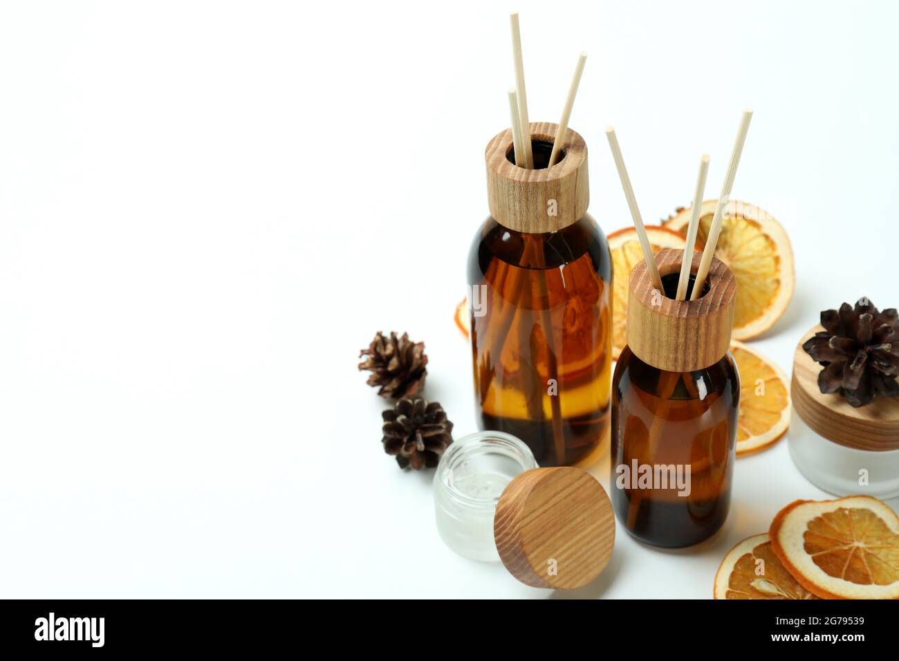 Diffusers, lemons and cones on white background Stock Photo