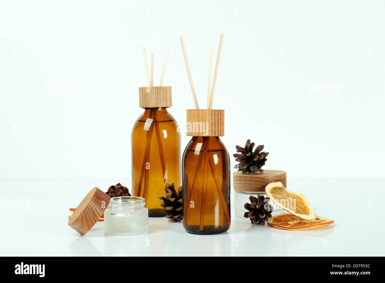 Diffusers, lemons and cones on white background Stock Photo
