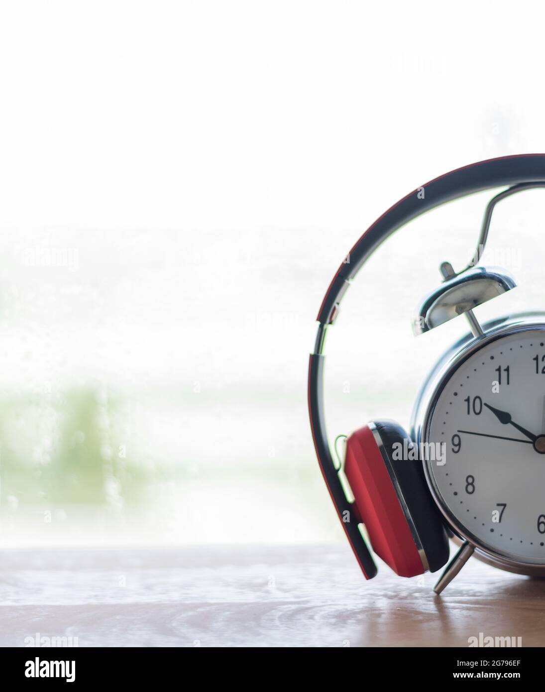 Listening to music Concept .Vintage Alarm clocks are listening by red