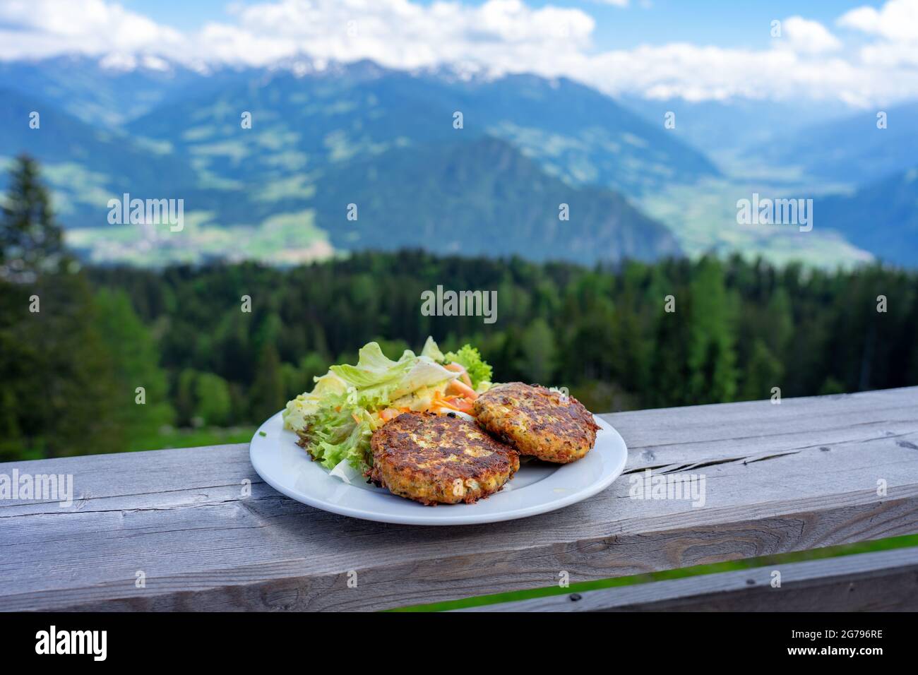 traditional local kaspressknodel cheese dumpling in tirol austria with mountain view landscape Stock Photo